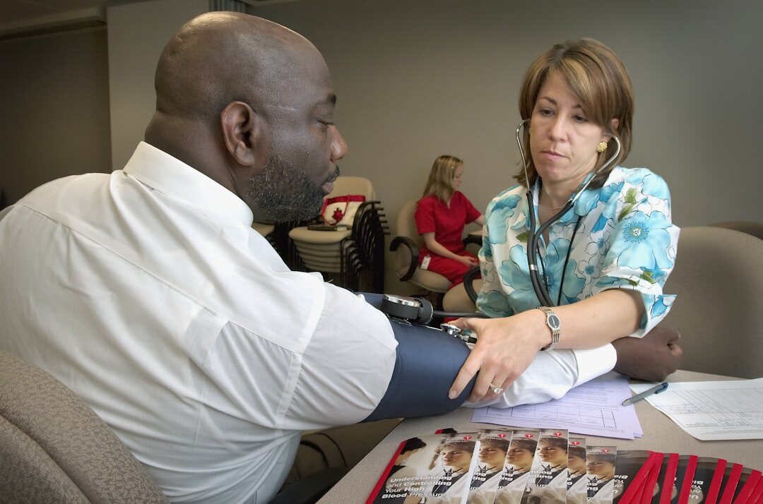 Advisor showing a watch to a seated client